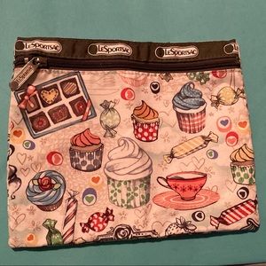 Le Sportsac flat pouch.  Cupcakes and sweets design - so cute.